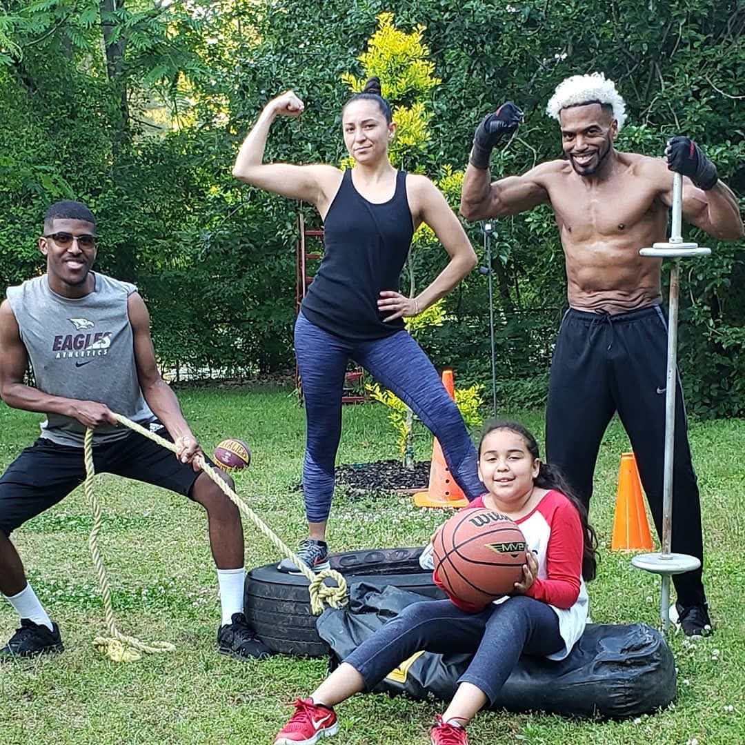 Coach Chill Will training clients outdoors